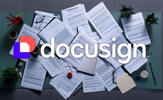 AI-generated image of a pile of contracts, agreements and documents on a desk surface with the Docusign logo overlayed on top.